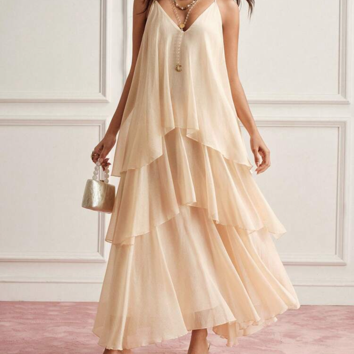 a model wearing the Beige Mesh Tiered Maxi Dress from Closet Concierge