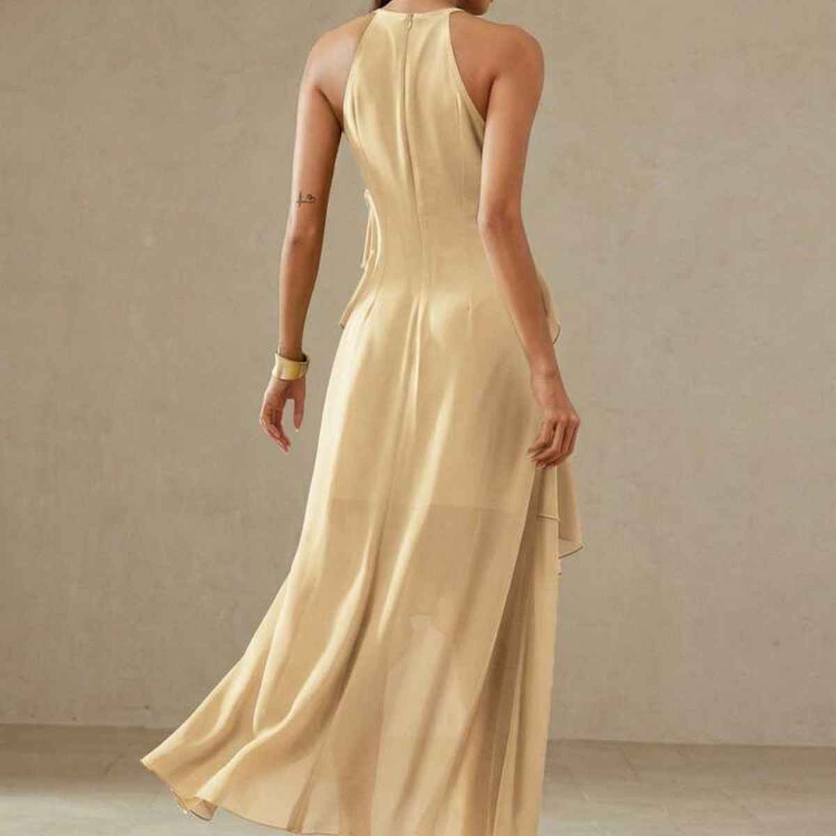 a model wearing the Beige Tiered Ruffle Midaxi Dress from Closet Concierge from the back
