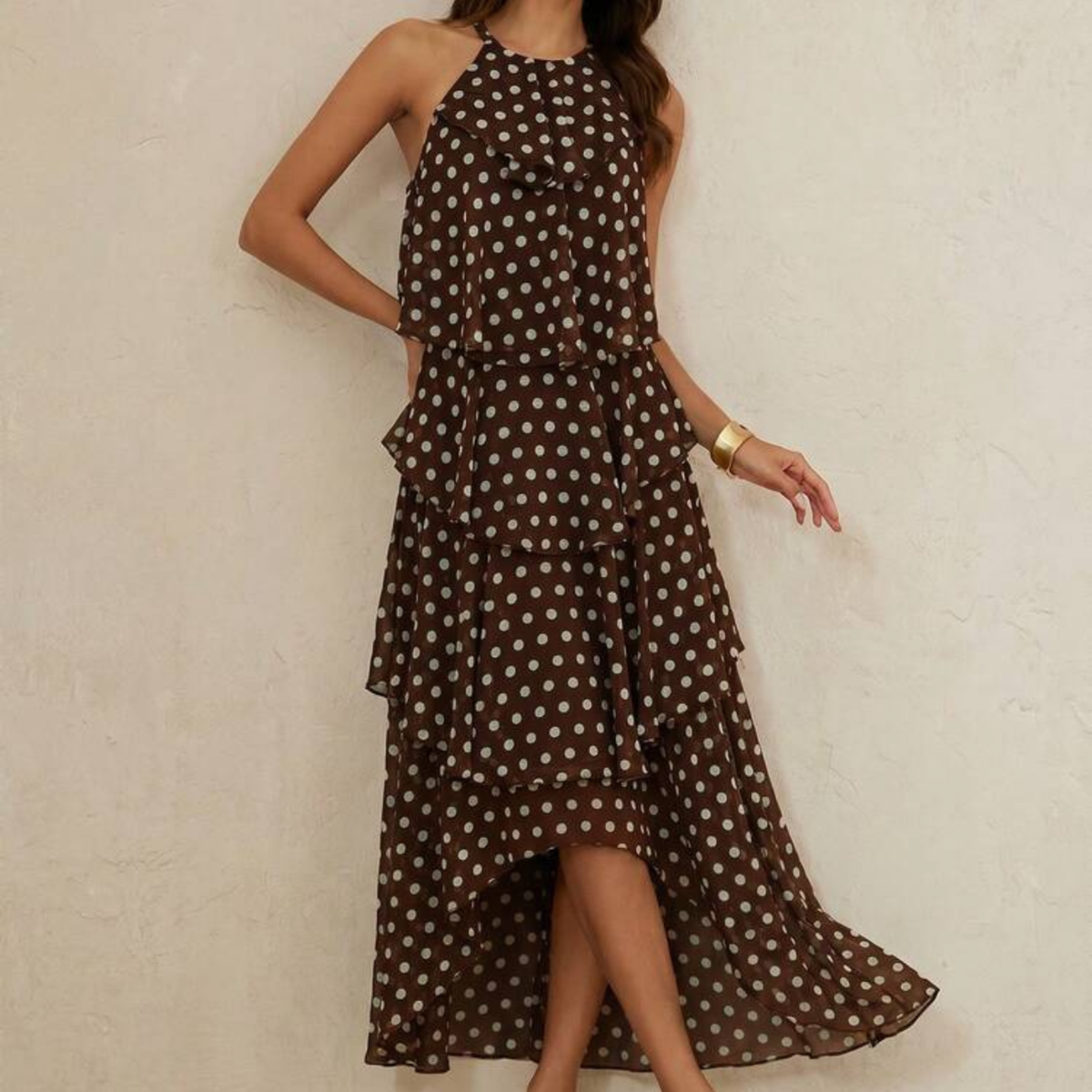 a model wearing the Brown Polka Dot Tiered Maxi Dress from Closet Concierge