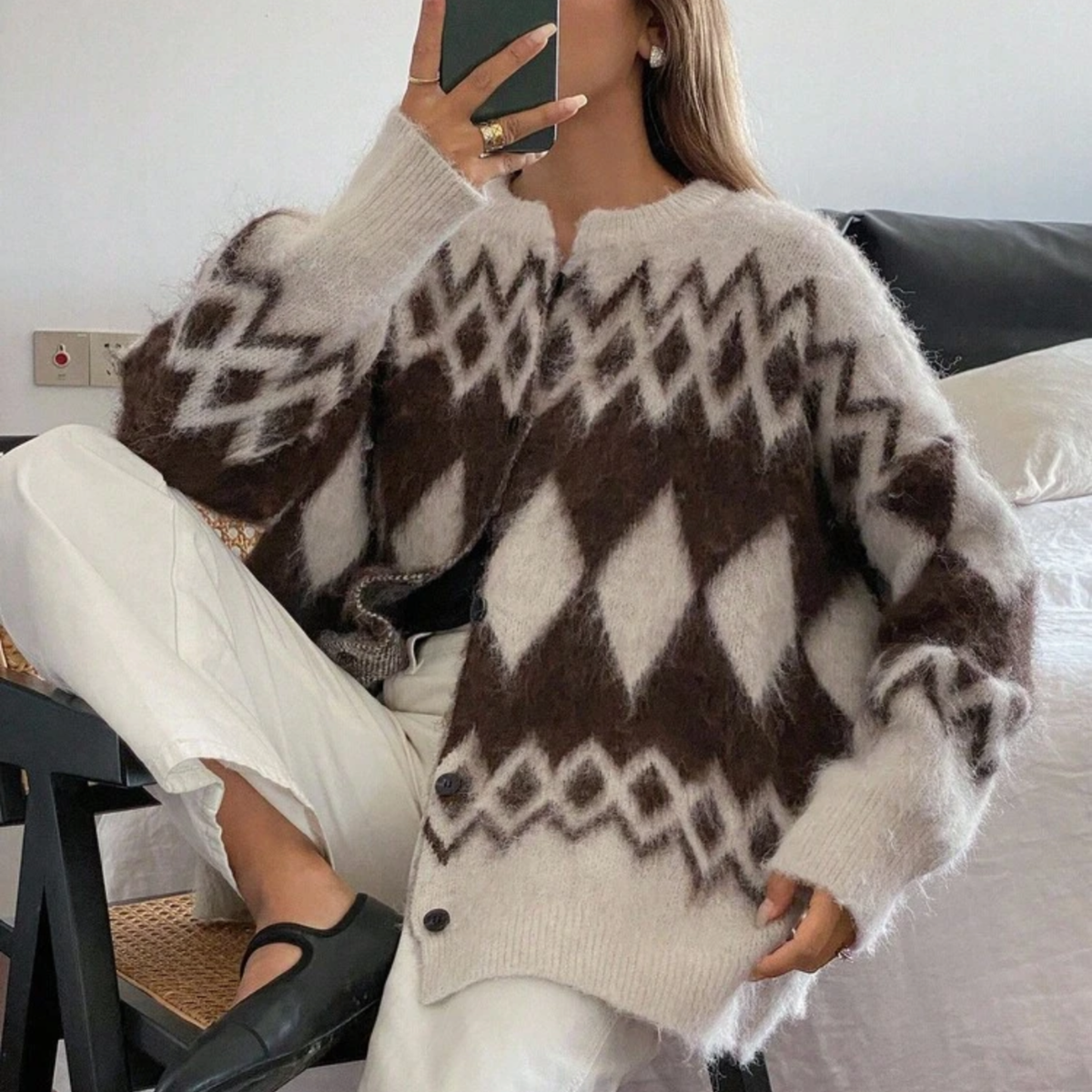 a model wearing the Chevron Fluffy Button Up Jumper from Closet Concierge