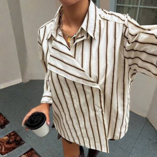 a model wearing the Dazy Asymmetric Striped Shirt from Closet COncierge