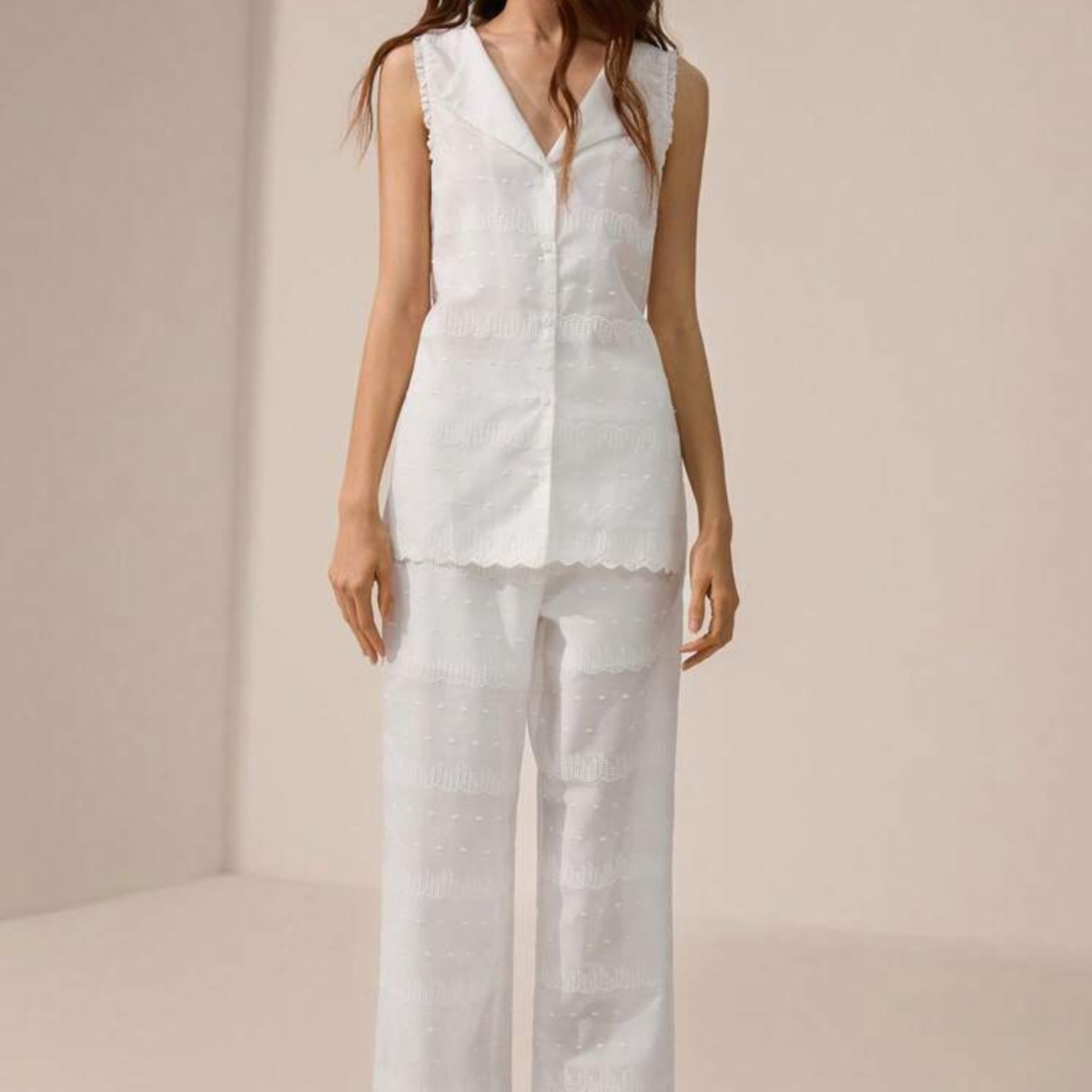 a model wearing the Embroidered White Co-Ord from Closet Concierge