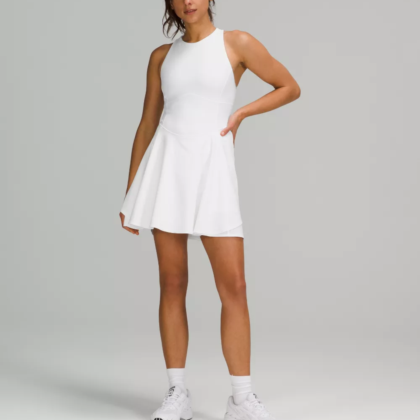 a model wearing the L’Couture Tennis/Gym Dress from Closet Concierge