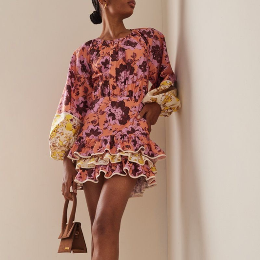 a model wearing the Significant Other ‘Ana’ Floral Mini Dress from Closet Concierge