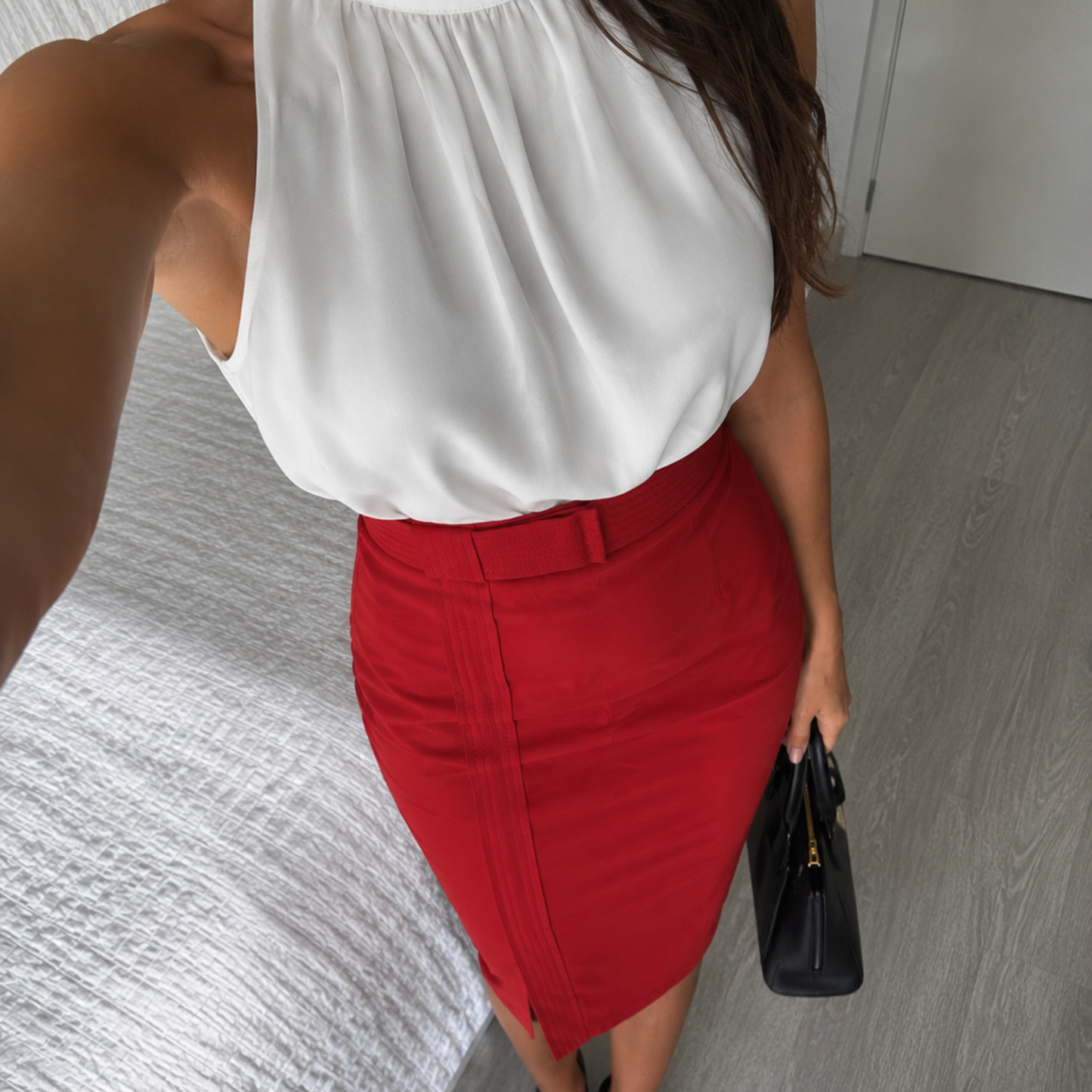 model wearing a carolina herrera red midi skirt from closet concierge 