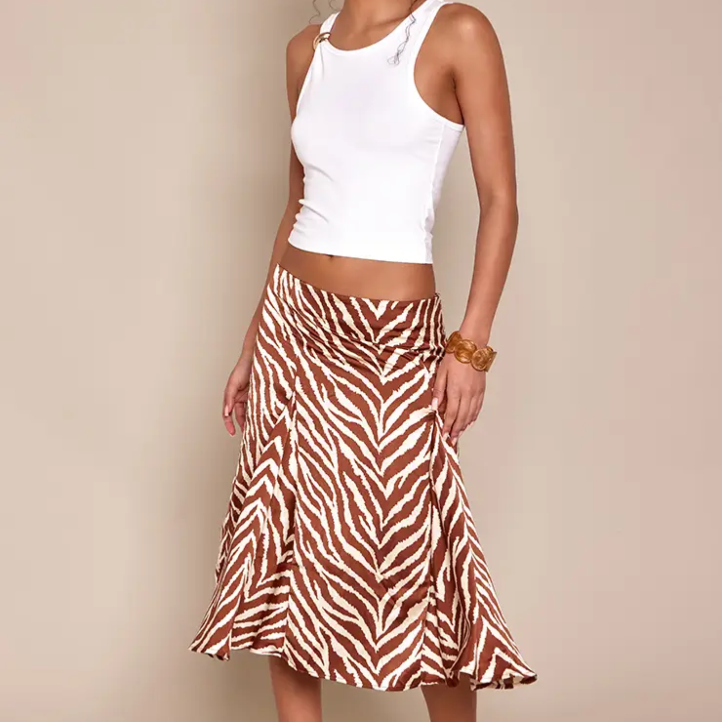 a model wearing the plt brown zebra print midi skirt from closet concierge