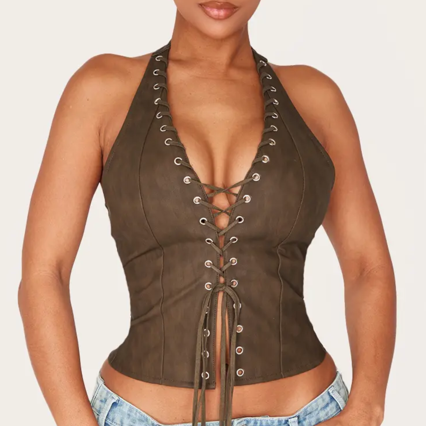 a model wearing the plt olive corset top from closet concierge